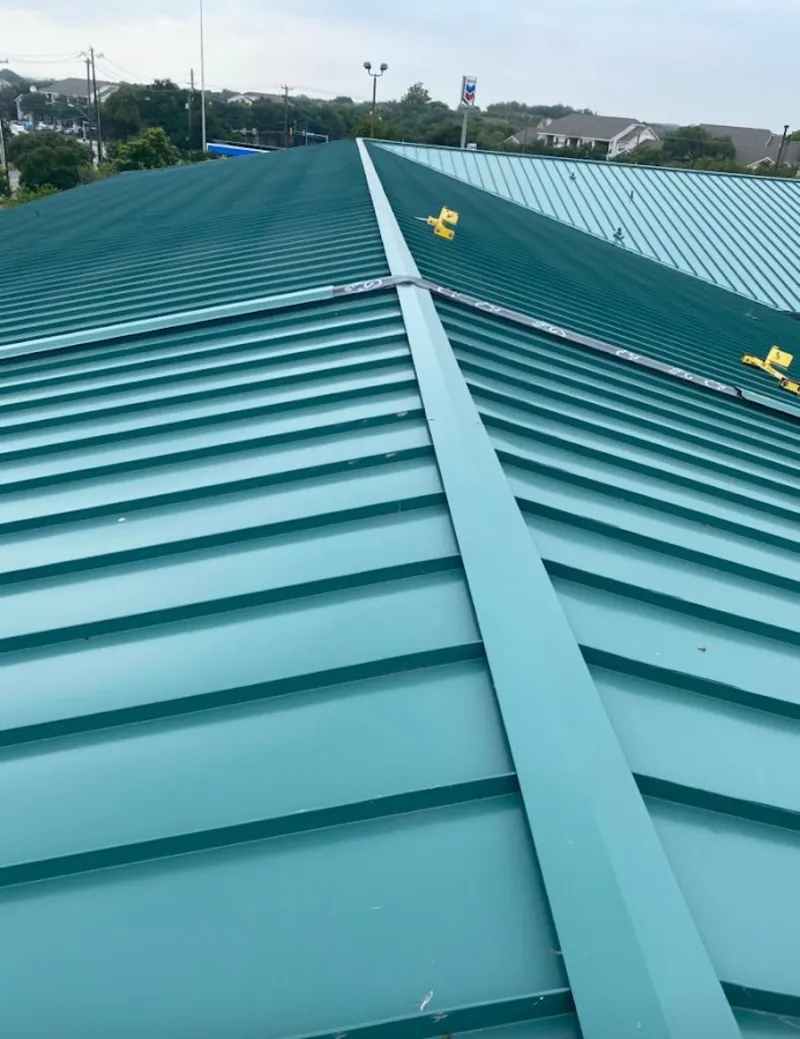 Green commercial metal roof ridge and valley for Metal Roof Repair in Orchard Homes